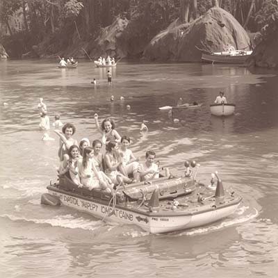 Vintage photo of paddle boating on the creek at Shadowbrook Restaurant in Capitola.